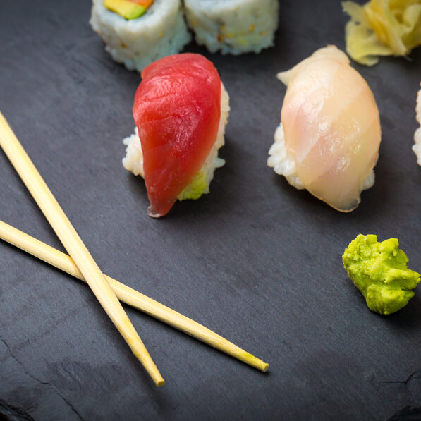 Sushi,And,Sashimi,Rolls,On,A,Black,Stone,Slatter.,Fresh